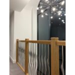 Timber staircase with chrome spindles